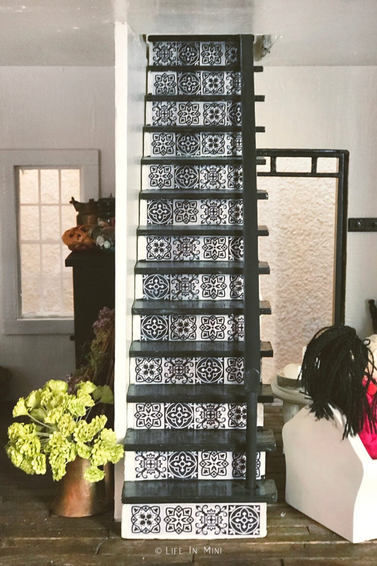 Dollhouse stairs painted white and black with Mexican talavera tile design