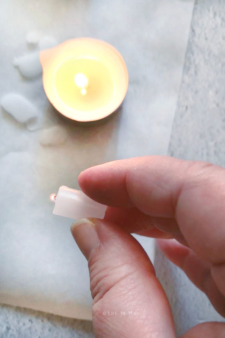 Mini candle with wick lit