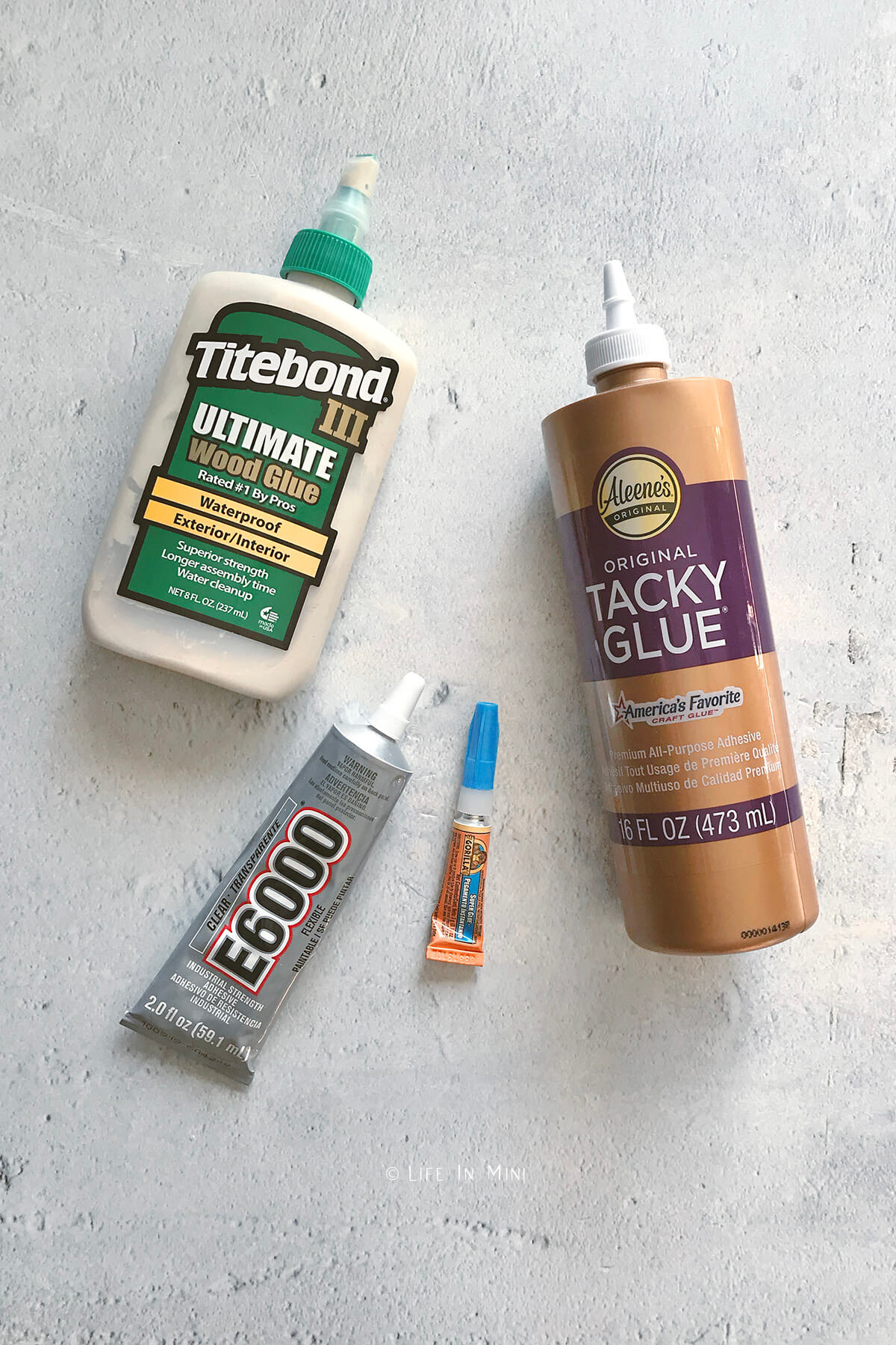 Assortment of glues used in building miniatures and dollhouse accessories