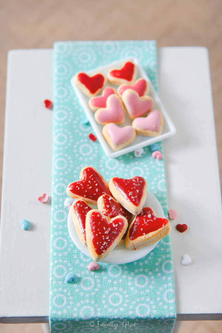 Miniature valentine heart cookies made with polymer clay on a dollhouse table
