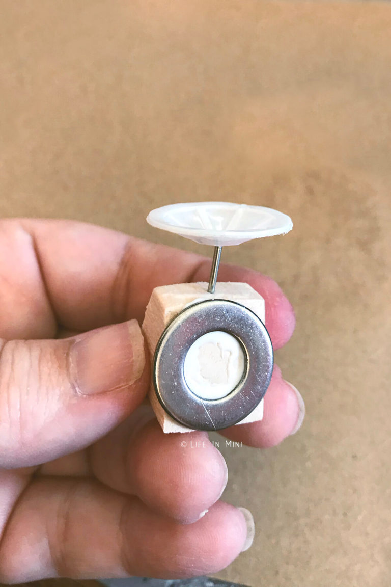 Rough assembly of a miniature kitchen scale made with scraps