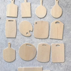 Miniature cutting boards of various shapes and sizes in natural light basswood