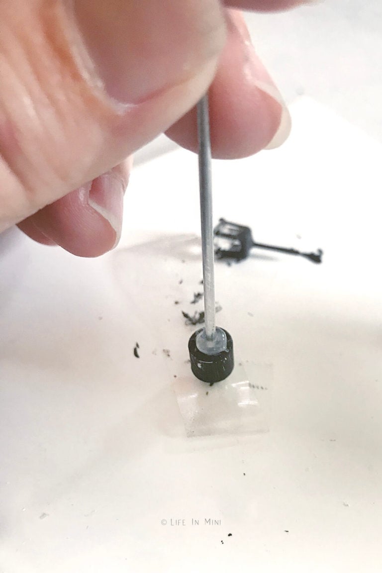 Adding hot glue to end of earring back