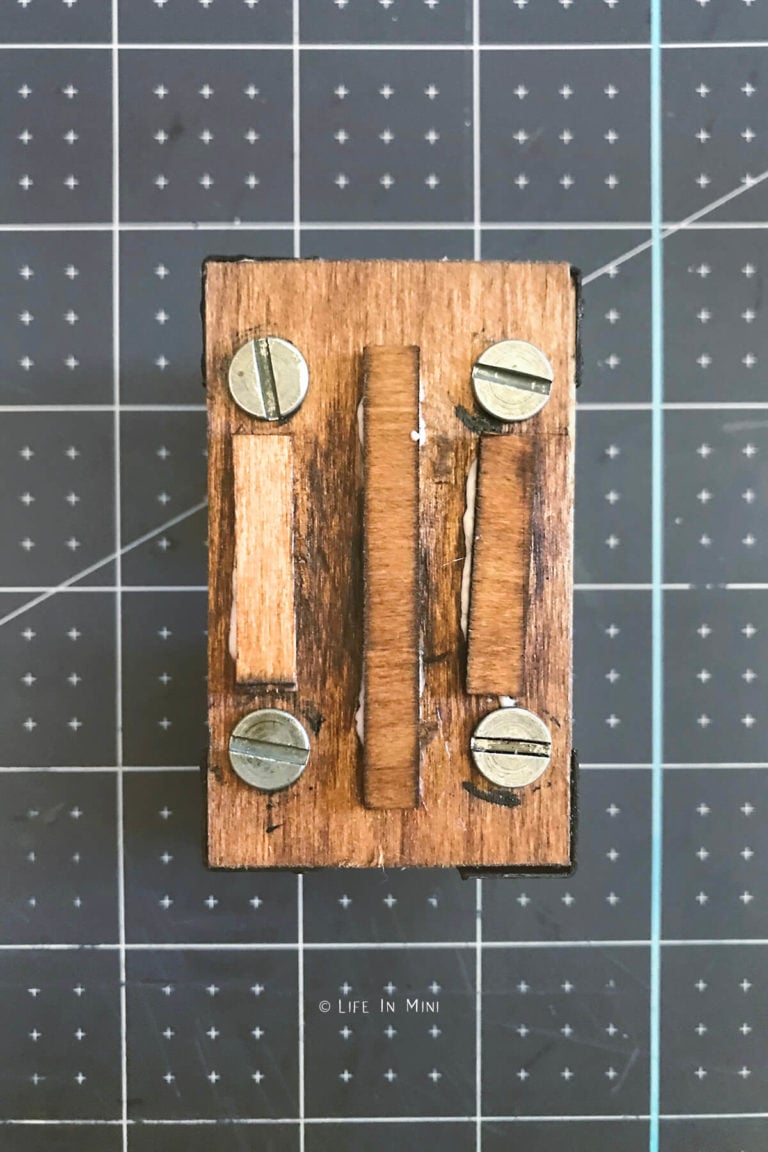 Top view of miniature coffee table with supports glued on