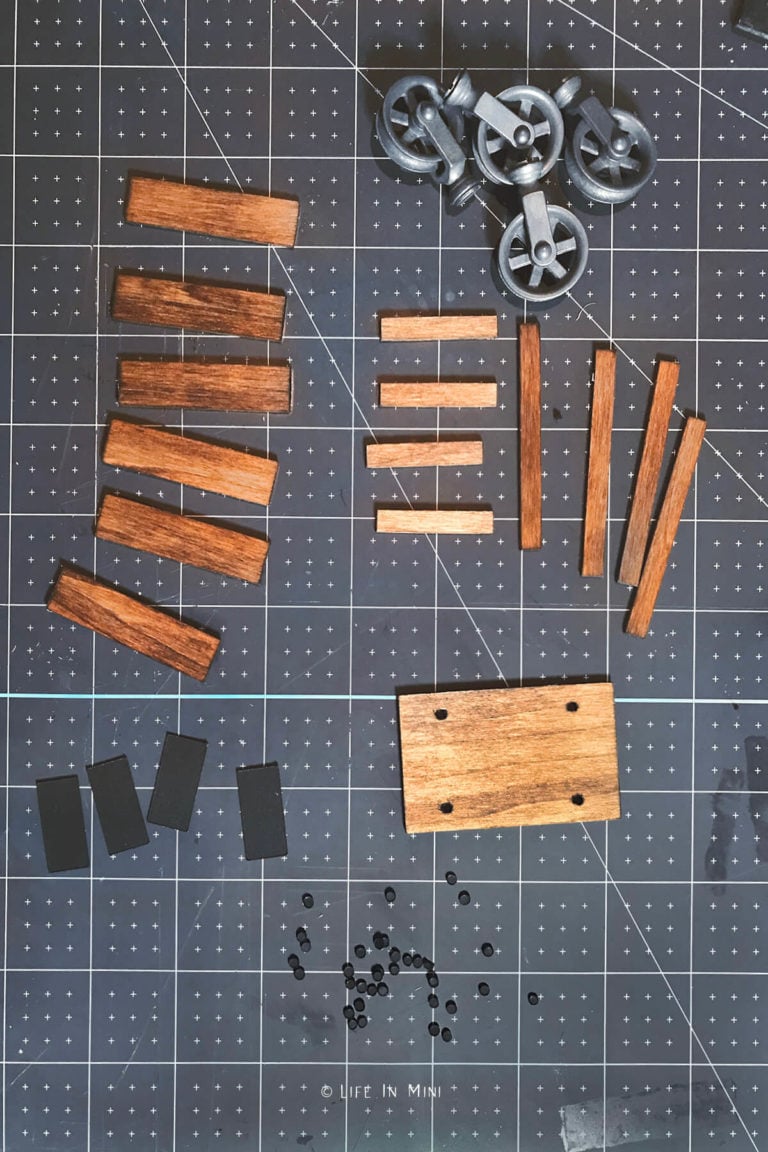 Small pieces of wood stained brown with other pieces to make an industrial coffee table