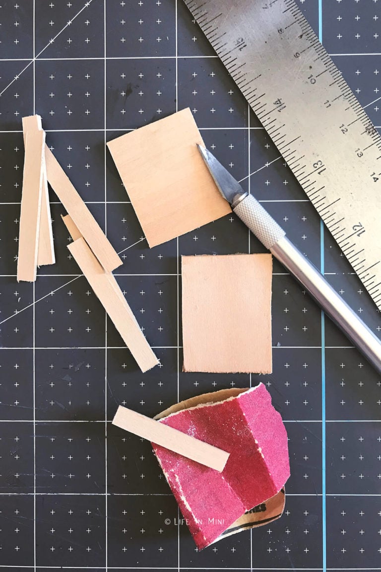 Cutting up scraps of basswood to make mini wooden trays