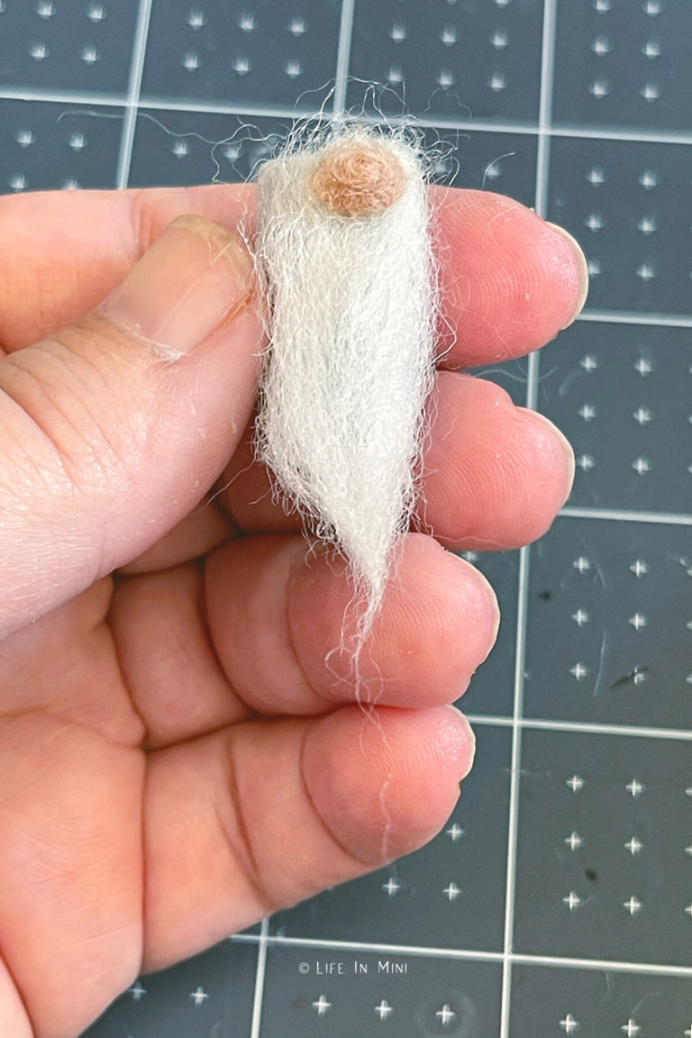 White beard and beige nose glued to make a mini gnome