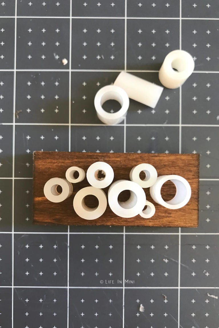 Nylon spacers on a wooden box to make a dollhouse chandelier