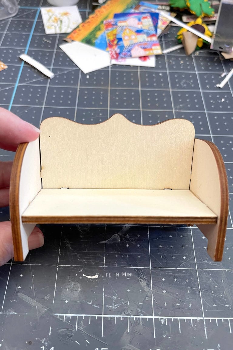 A simple miniature sofa made of wood