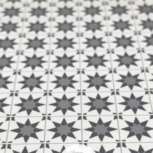Closeup of grey star dollhouse tile flooring