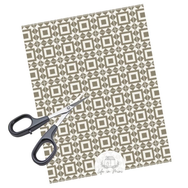 A sheet of taupe square geometric miniature dollhouse tile in 1:6 scale with scissors
