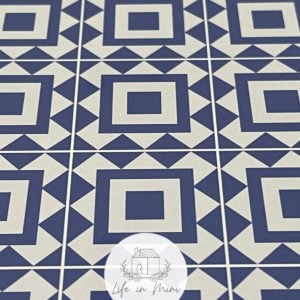 Closeup of 1:6 blue square geometric dollhouse tile flooring