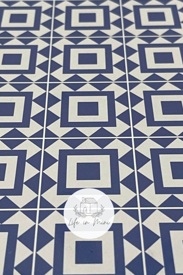 Closeup of 1:6 blue square geometric dollhouse tile flooring