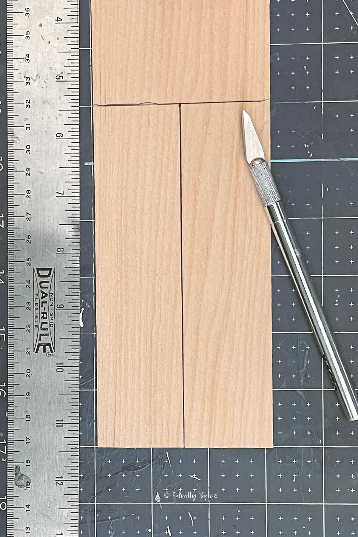 Marking lines to cut on a sheet of basswood