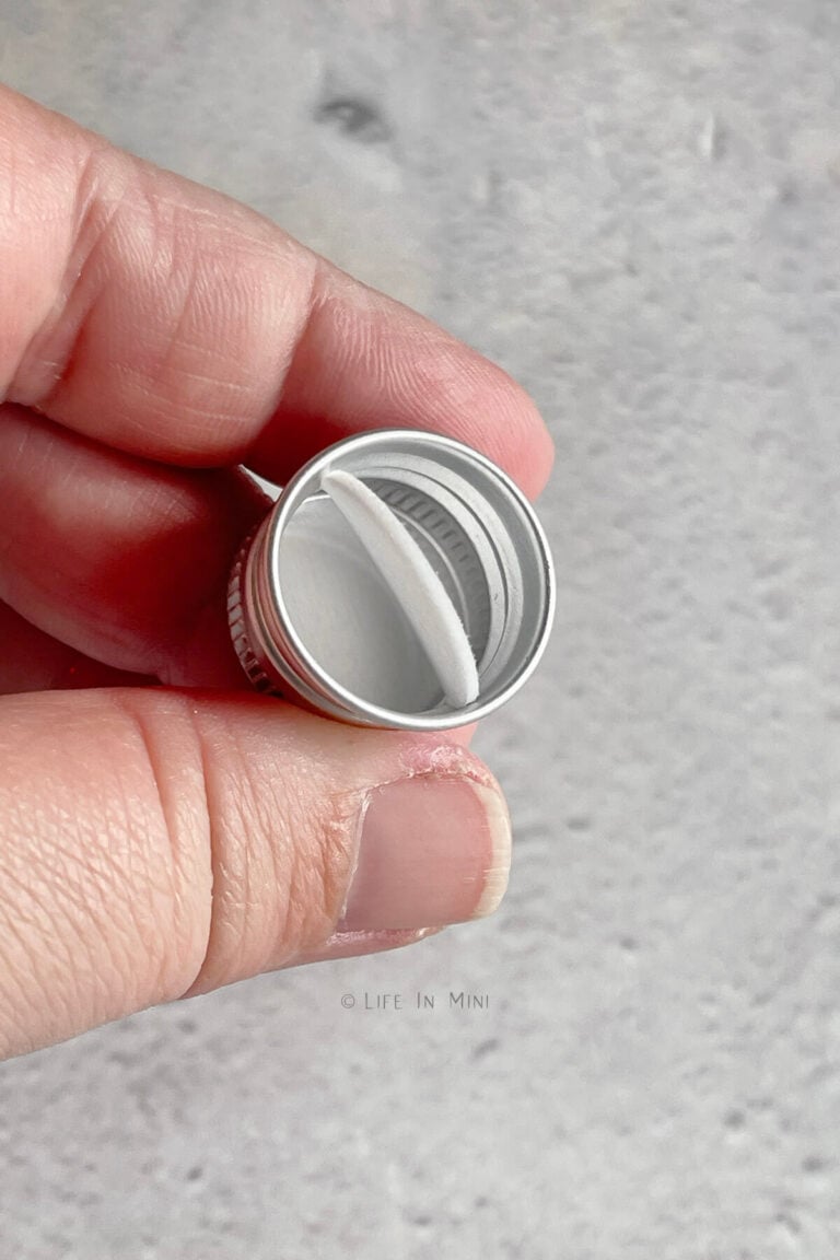 Removing the paper inside the lid of a mini jar