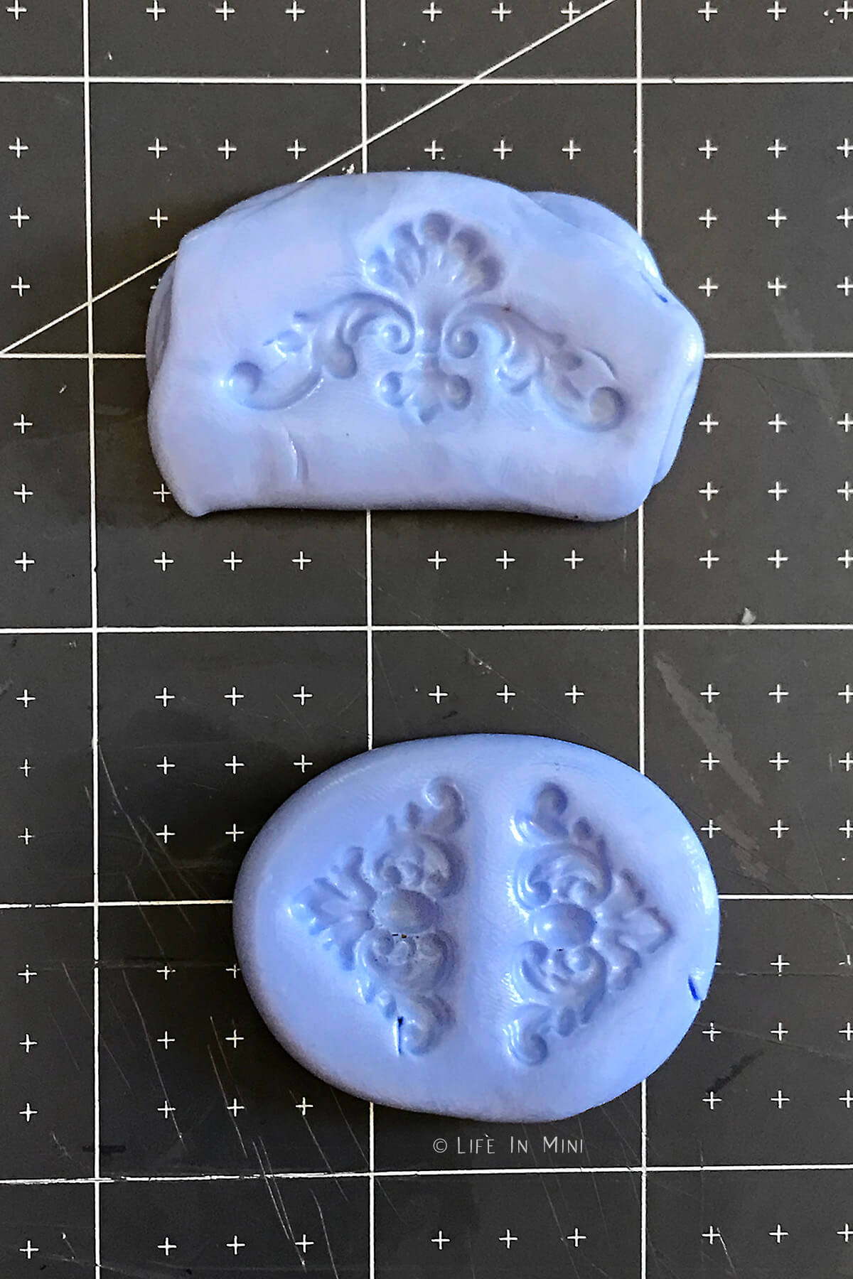 Resin molds made from scrapbook pieces