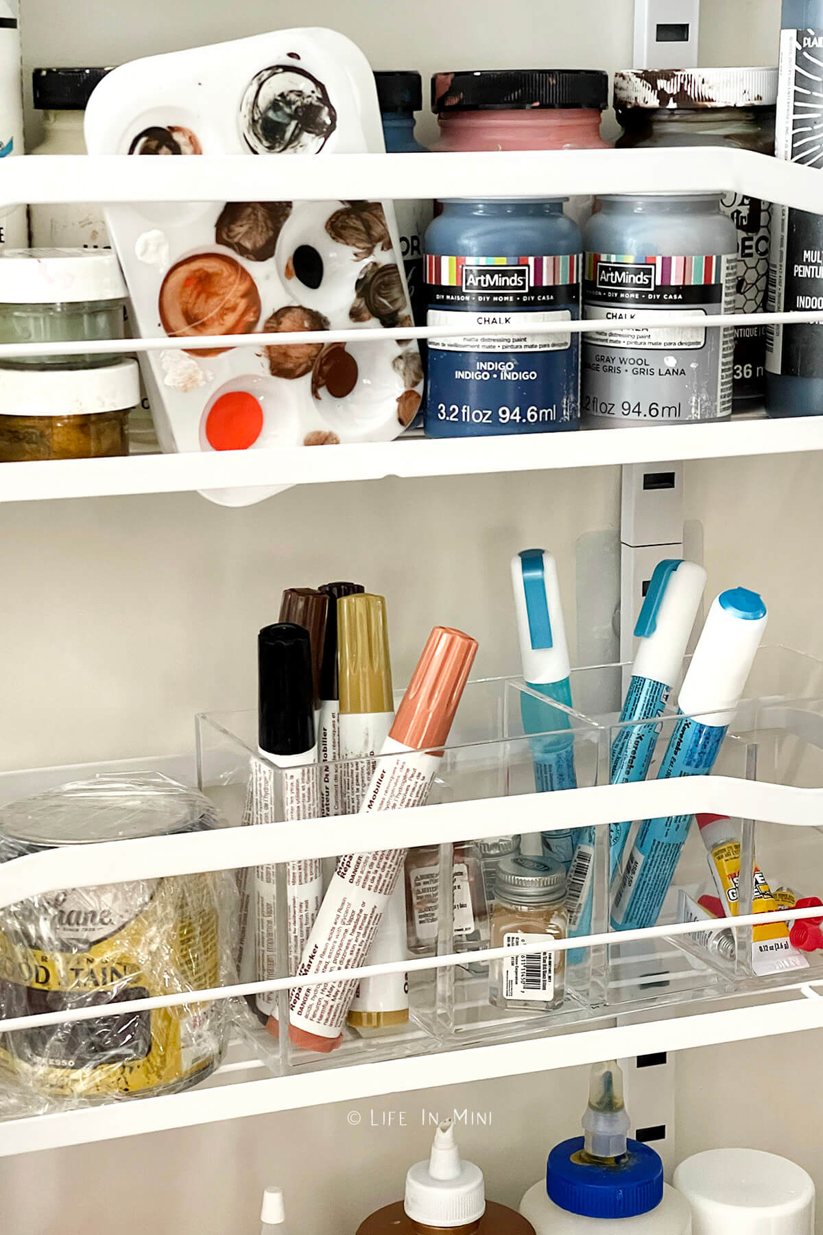 Close up of art supplies in a over the door pantry organizer