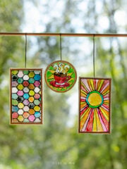 Three miniature stained glass pieces: honeycomb, coffee mug and sunburst