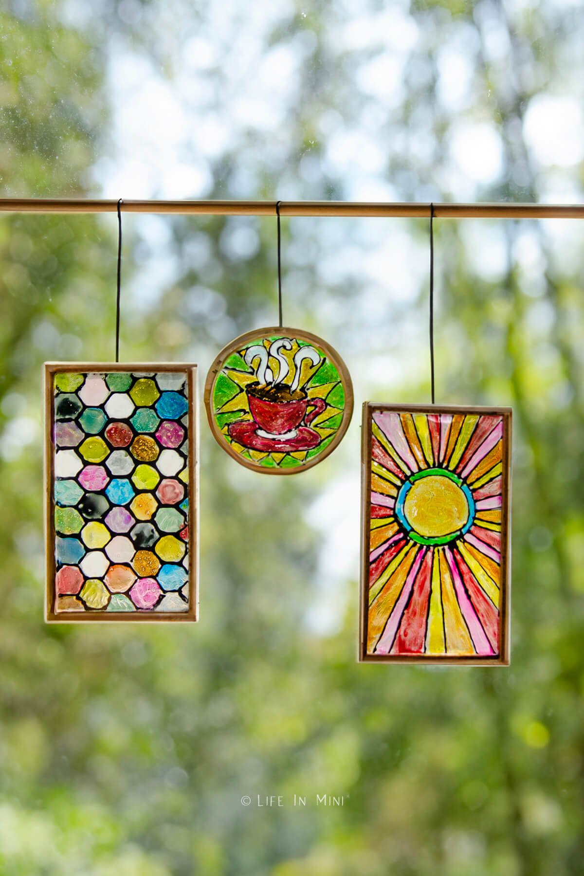 Three miniature stained glass pieces: honeycomb, coffee mug and sunburst