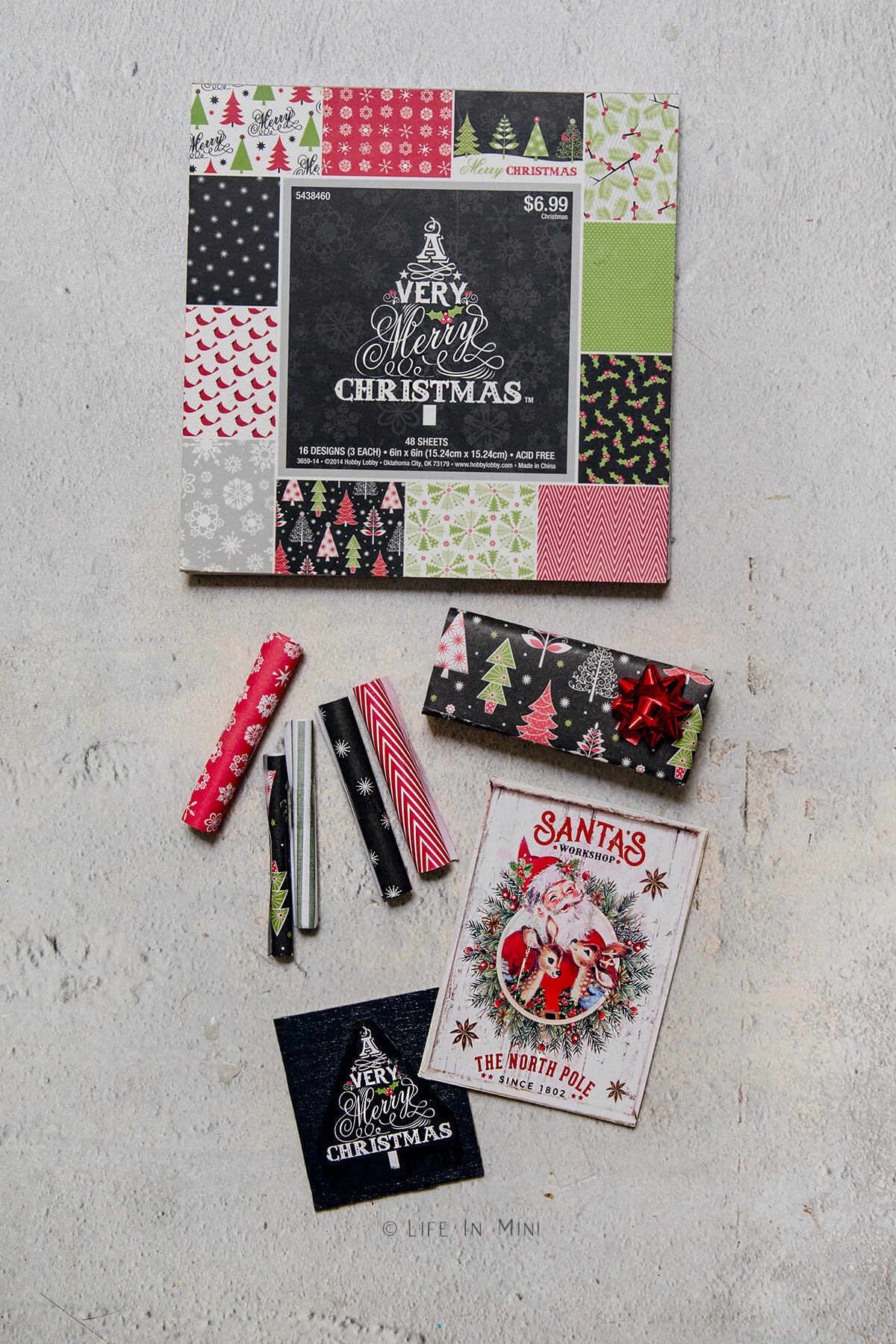 Assorted Christmas themed scrapbook paper.