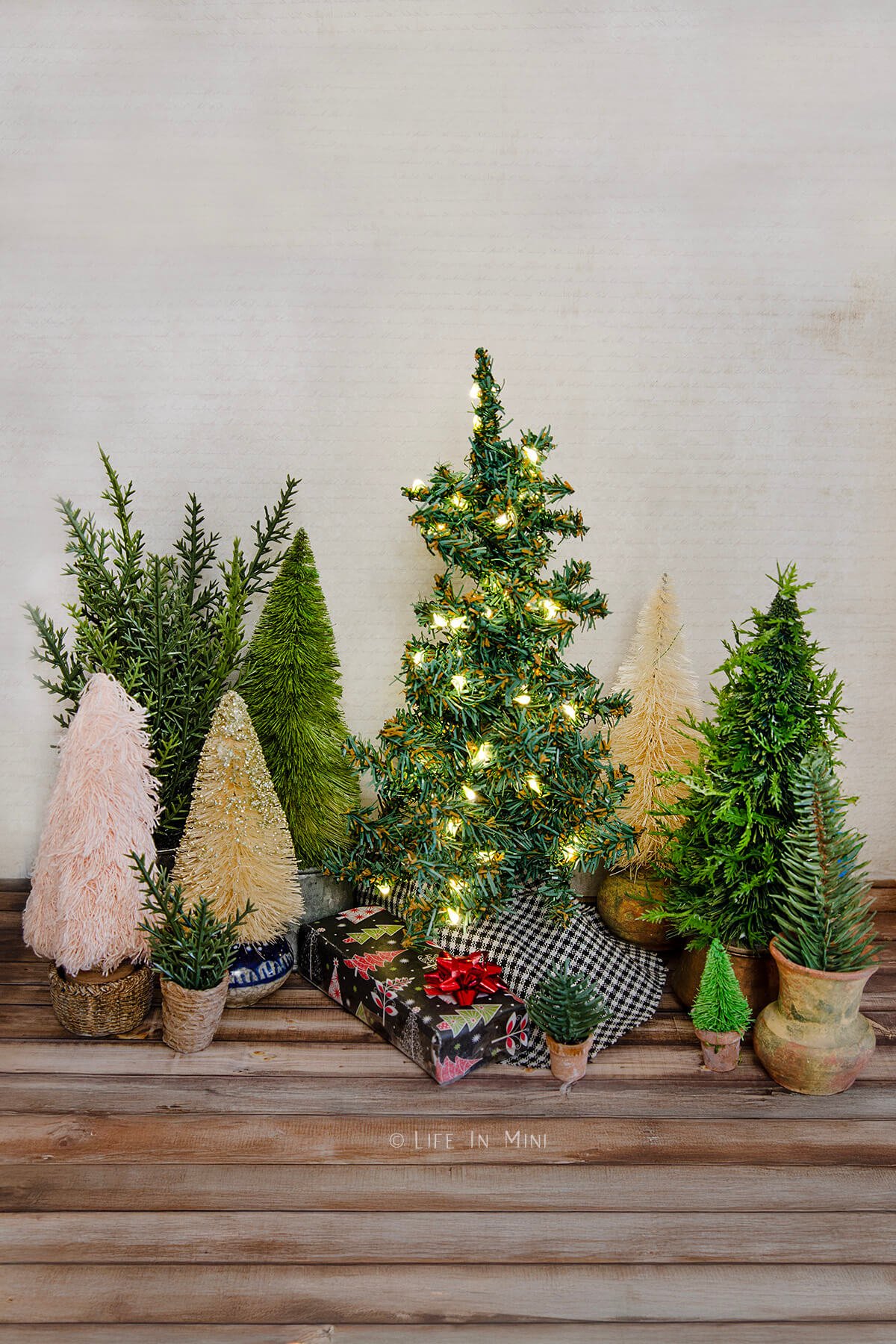 Several different kinds of dollhouse Christmas trees.